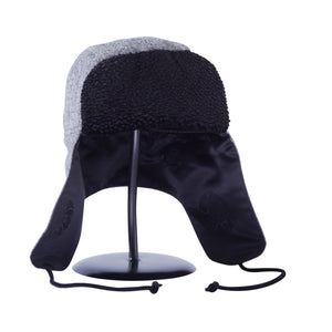 Image of a black and white wool Trapper of Colorado brand dressy "trapper hat" or "bomber hat" with black satin lining and black faux fur vegan brim for men or women to wear